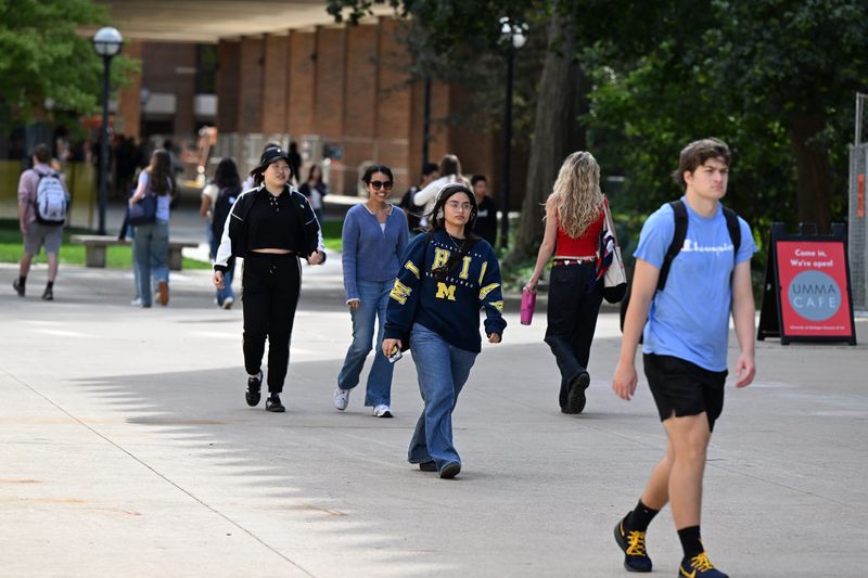 University of Michigan students walk across campus in front to the UMMA building on the first day of classes, Monday, August 25, 2025 in Ann Arbor.