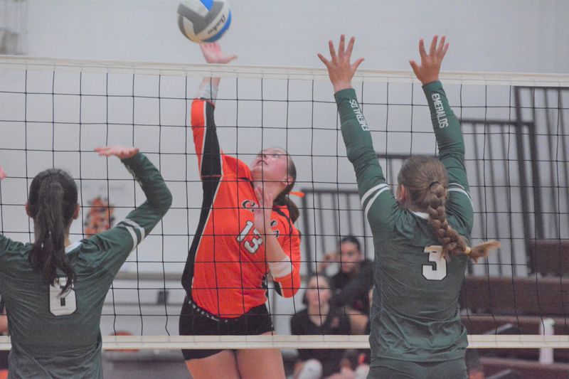 Cheboygan senior Tessa Lake (13) goes up for an attack during a volleyball match against Manistique at the Pellston Invitational on Saturday, Aug. 23.