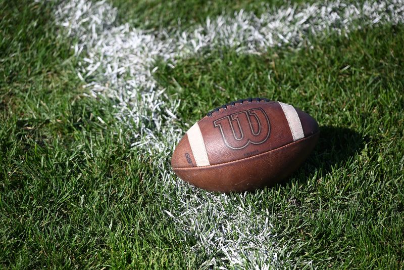 A football sits on the field at Northern High School in Port Huron on Monday, Aug. 25, 2025.