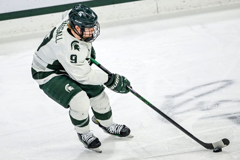 Michigan State's Matt Basgall moves the puck against Minnesota during the first period on Saturday, Jan. 25, 2025, at Munn Arena in East Lansing.
