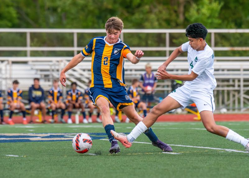 South Lyon's Evan Shamberger wins possession during a boys soccer match on Tuesday, Aug. 26, 2025.