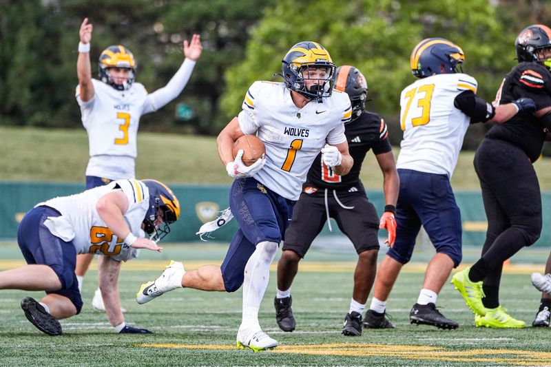 Clarkston running back Lucas Bowman (1) runs for a touchdown against Belleville during the second half of Prep Kickoff Classic at Wayne State University' Adams Field in Detroit on Thursday, August 28, 2025.