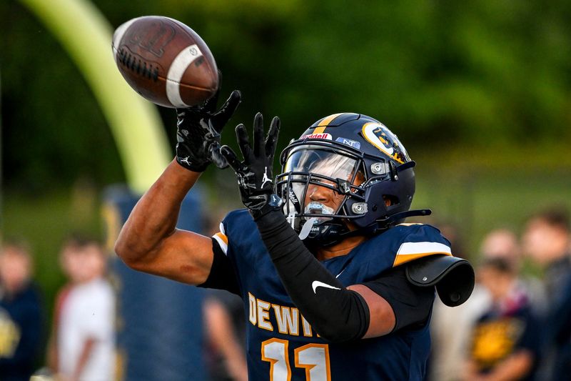 DeWitt's Jadon Bender catches a touchdown pass against Haslett during the second quarter on Thursday, Aug. 28, 2025, in East Lansing.