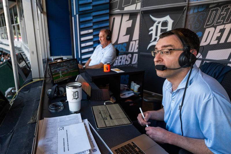Detroit Tigers TV announcers Jason Benetti and Dan Petry call a game against the Houston Astros at Comerica Park in Detroit on Monday, Aug. 18, 2025.