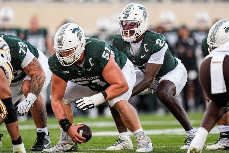 Michigan State quarterback Aidan Chiles (2) calls for a snap from offensive lineman Matt Gulbin (51) against Western Michigan during the first half at Spartan Stadium in East Lansing on Friday, August 29, 2025.