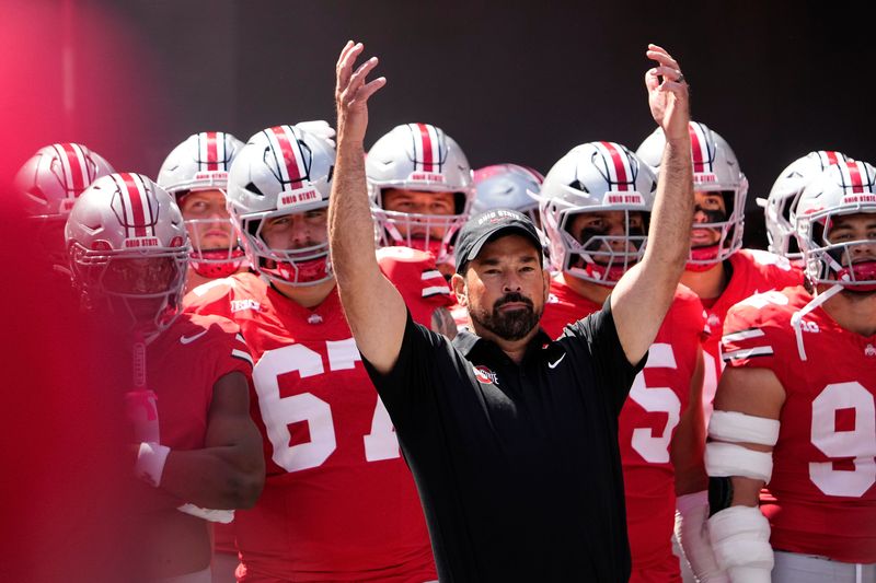 Ohio State Buckeyes head coach Ryan Day leads his team onto the field prior to the game against the Texas Longhorns at Ohio Stadium on Aug. 30, 2025.