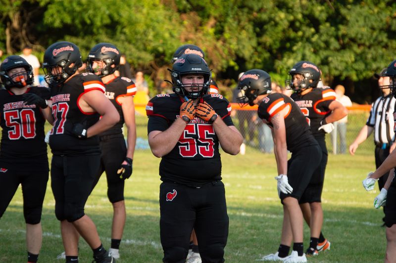 Junior Harper Griffiths (55) gets the defensive call from the Comet sideline.
