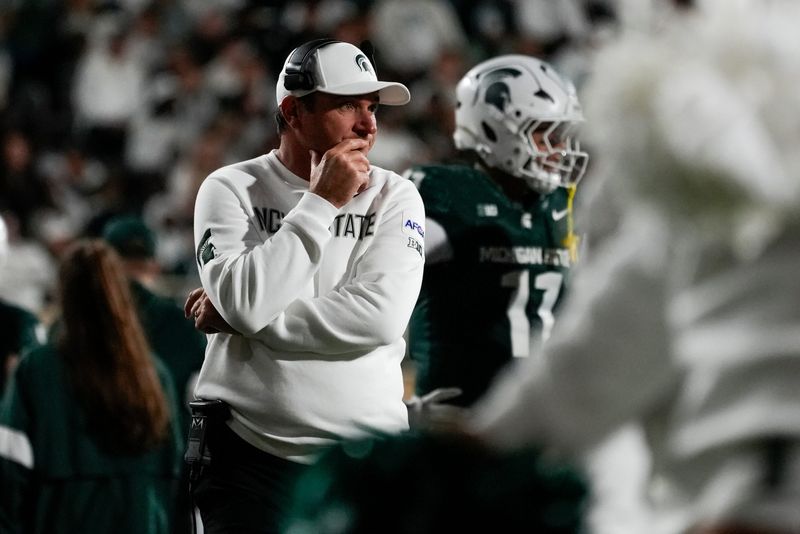 Aug 29, 2025; East Lansing, Michigan, USA; Michigan State Spartans head coach Jonathan Smith reacts to a play in the third quarter at Spartan Stadium. Mandatory Credit: Brendan Mullin-Imagn Images