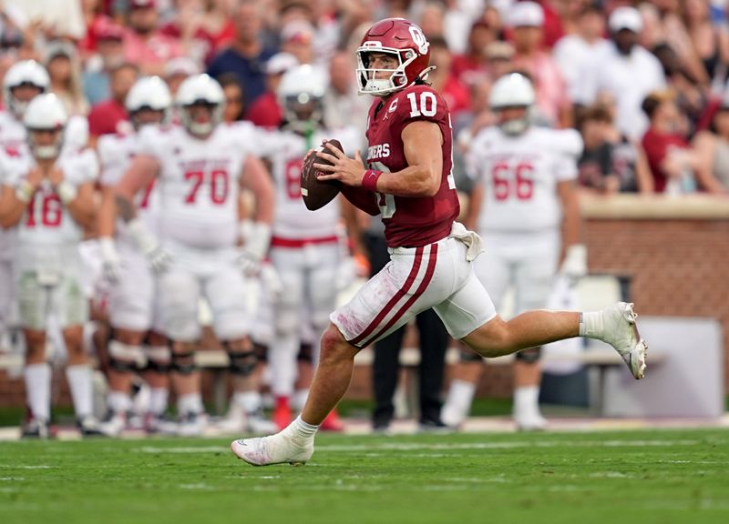 Oklahoma's John Mateer (10) scrambles in the second half of the college football game between the University of Oklahoma Sooners and the Illinois State Redbirds at the Gaylord Family Oklahoma Memorial Stadium in Norman, Okla., Saturday, Aug. 30, 2025.
