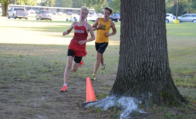New Boston Huron's Cameron Crane and Lucas Taraszkiewicz of Flat Rock turn a corner during the Frank Connolly Relays at Erie Mason on Tuesday, Sept. 2, 2025.
