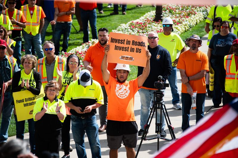 Thousands rally at the state Capitol in downtown Lansing, Wednesday, Sept. 3, 2025, for the 'Save our Jobs, Fund our Roads rally.