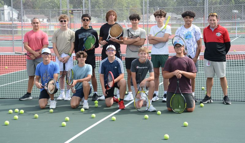 Monroe's boys tennis team poses for a photo on its freshly resurfaced courts during practice on Thursday, Sept. 4, 2025.
