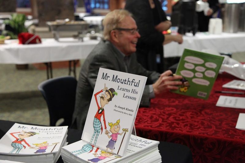 Joe Kimble, professor emeritus at Cooley Law School, at a book signing event.