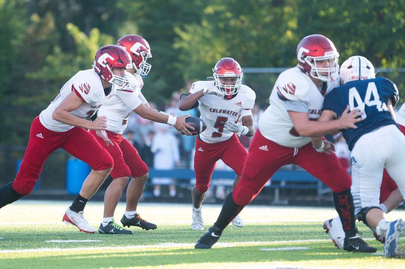 Dracyn Foster hands off to teammate Royale Fleming early this season. Fleming scored his first varsity touchdown versus Northwest on Friday