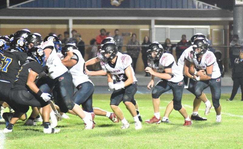 Clinton's three headed rushing monster includes, from left, Isaac Keibler (33), Braxton Randolph (40) and Clifford Jones (5).