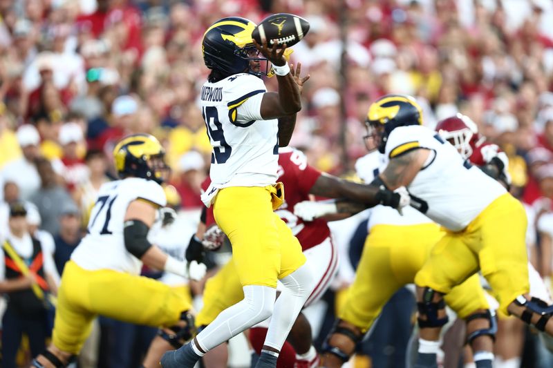 Michigan Wolverines quarterback Bryce Underwood (19) passes downfield against the Oklahoma Sooners during the first half at Gaylord Family-Oklahoma Memorial Stadium in Norman, Oklahoma, on Saturday, Sept. 6, 2025.