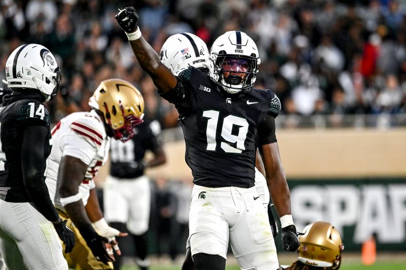 Michigan State's Armorion Smith celebrates after tackling Boston College's Lewis Bond during the first quarter on Saturday, Sept. 6, 2025, at Spartan Stadium in East Lansing.