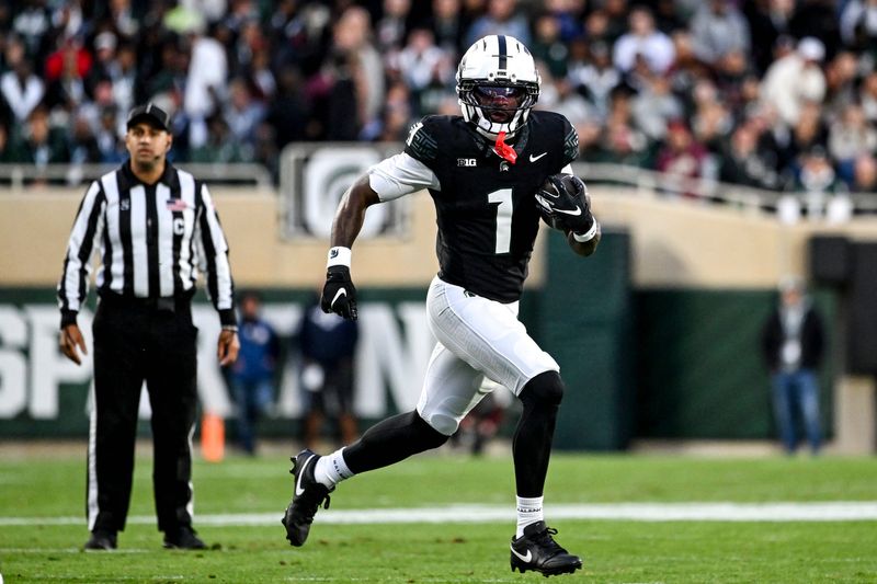 Michigan State's Omari Kelly runs for a gain against Boston College during the first quarter on Saturday, Sept. 6, 2025, at Spartan Stadium in East Lansing.
