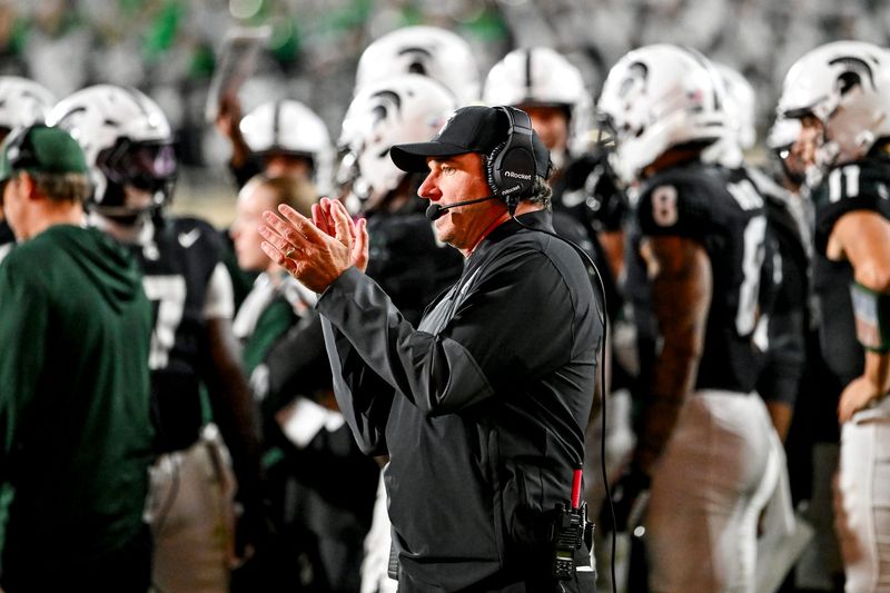 Michigan State's head coach Jonathan Smith claps while looking on during the second overtime in the game against Boston College on Saturday, Sept. 6, 2025, at Spartan Stadium in East Lansing.