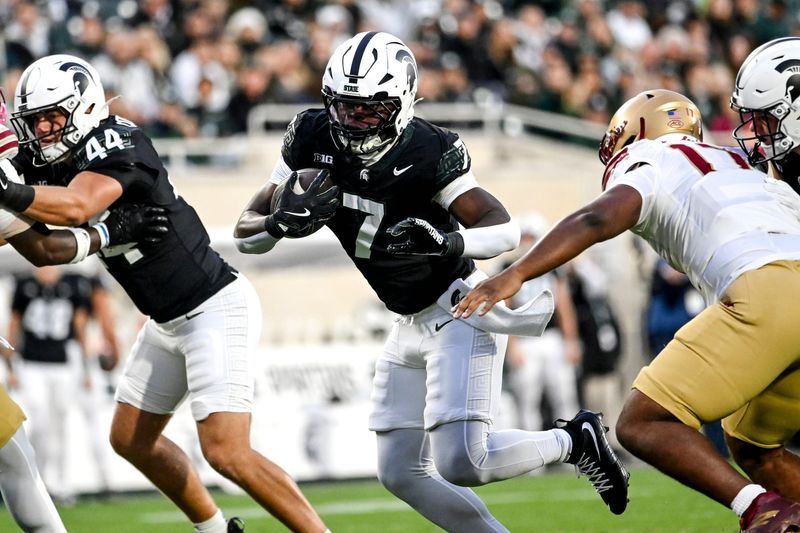 Michigan State's Brandon Tullis runs for a gain against Boston College's during the first quarter on Saturday, Sept. 6, 2025, at Spartan Stadium in East Lansing.