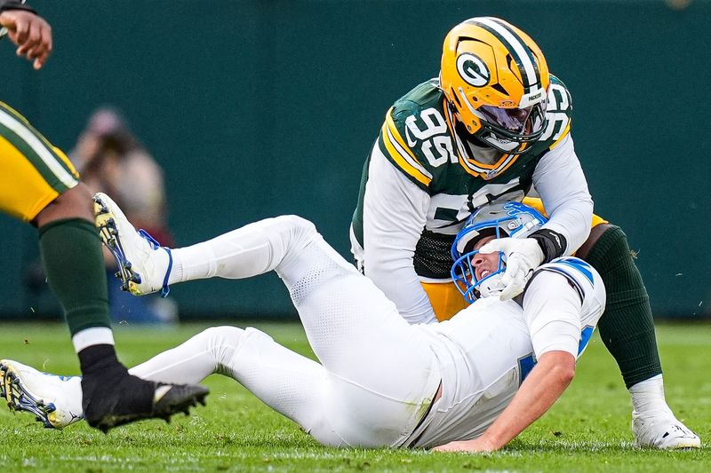 Detroit Lions quarterback Jared Goff is tackled by Green Bay Packers defensive tackle Devonte Wyatt during the second half at Lambeau Field in Green Bay, Wis., on Sunday, September 7, 2025.