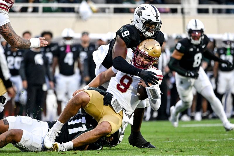 Michigan State's Anelu Lafaele, bottom, and Jalen Thompson, top, tackle Boston College's Dylan Lonergan during the first quarter on Saturday, Sept. 6, 2025, at Spartan Stadium in East Lansing.