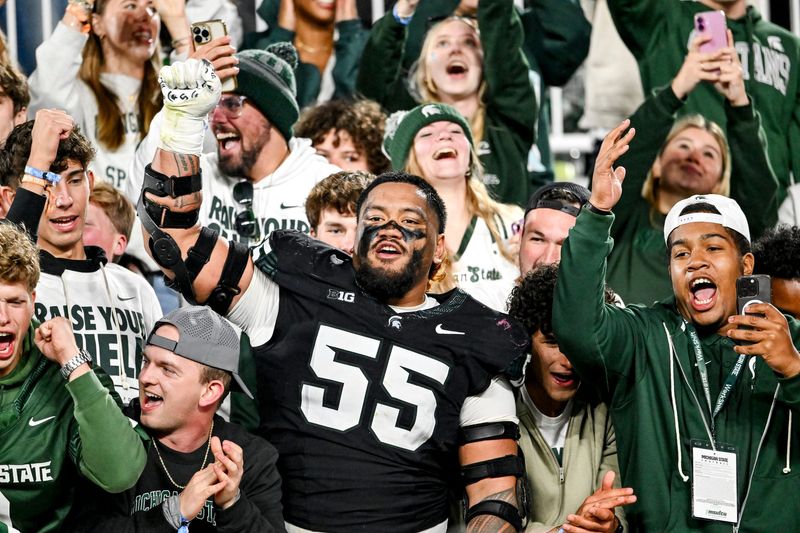 Michigan State's Ben Roberts celebrates with fans after defeating Boston College on Saturday, Sept. 6, 2025, at Spartan Stadium in East Lansing.