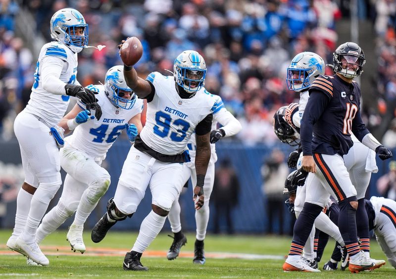 Detroit Lions defensive end Josh Paschal (93) celebrates a fumble recovery against Chicago Bears during the first half at Soldier Field in Chicago, Ill. on Sunday, Dec. 22, 2024.