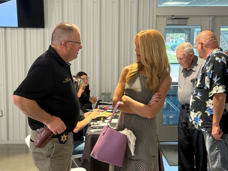 Sheriff Troy Goodnough greets people at the door for the spaghetti fundraiser.