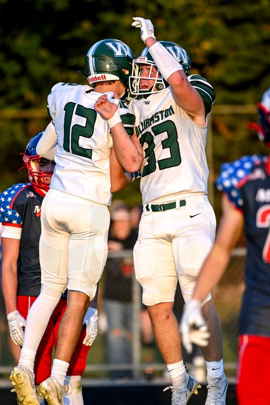 Williamston's Hunter VanSickler, left, celebrates his touchdown with teammate Miles Keener during the first quarter in the game against Mason on Friday, Sept. 12, 2025, at Mason High School.