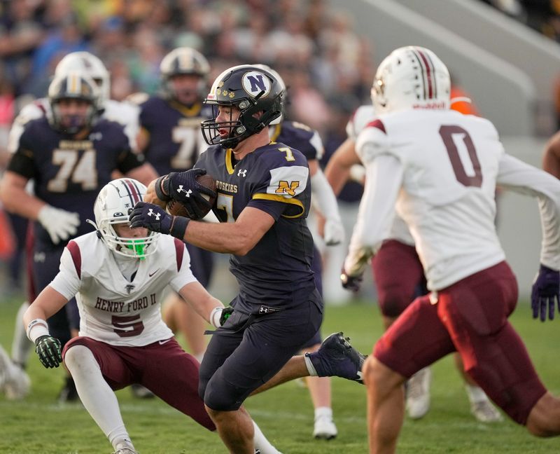 Port Huron Northern's Lincoln Watkins carries the ball during a game against Utica Ford at Memorial Stadium in Port Huron on Friday, Sept. 12, 2025.
