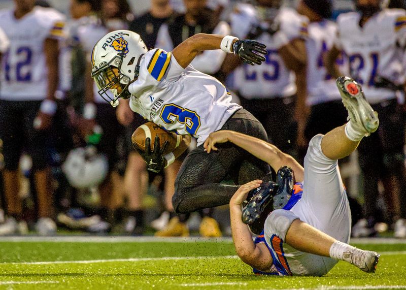 Garden City's Talan Domke tackles Redford Union's Zaire Agnew during a Western Wayne Athletic Conference football game on Friday, Sept. 12, 2025.
