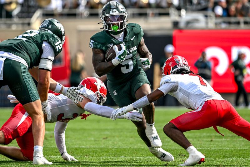Michigan State's Makhi Frazier runs for a gain against Youngstown State during the first quarter on Saturday, Sept. 13, 2025, at Spartan Stadium in East Lansing.