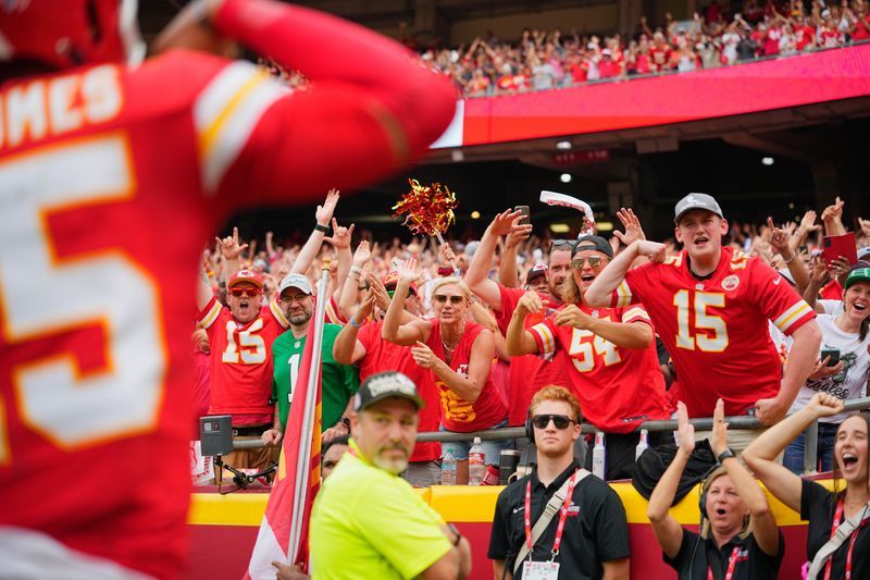 Week 2: Kansas City Chiefs fans celebrate after a touchdown by Patrick Mahomes (15) against the Philadelphia Eagles during the second quarter at Arrowhead Stadium.