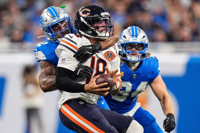 Detroit Lions safety Brian Branch (32) sacks Chicago Bears quarterback Caleb Williams (18) during the second half at Ford Field in Detroit on Sunday, Sept. 14, 2025.