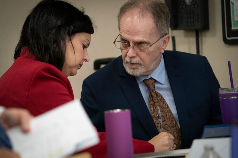 Defense attorney Alona Sharon, left, speaks to her client, Jeffrey Mosteller, before a court hearing in 52-4 District Court in Troy on Monday, Sept. 15, 2025. The owner of the Oxford Center, Tamela Peterson, and employees Gary Marken, Mosteller and Aleta Harward Moffitt are all charged in the the Jan. 31 death of Thomas Cooper in a hyperbaric chamber fire. Judge Maureen M. McGinnis is to determine whether they should be bound over to trial.