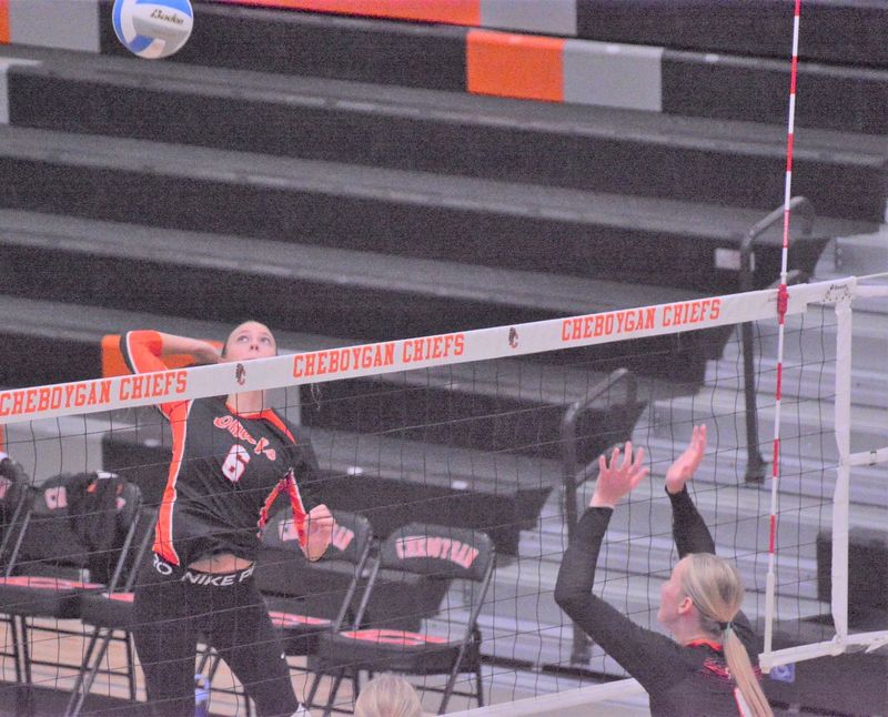 Cheboygan senior Abi Babcock (left) goes up for an attack during a volleyball match against Elk Rapids on Tuesday, Sept. 9.