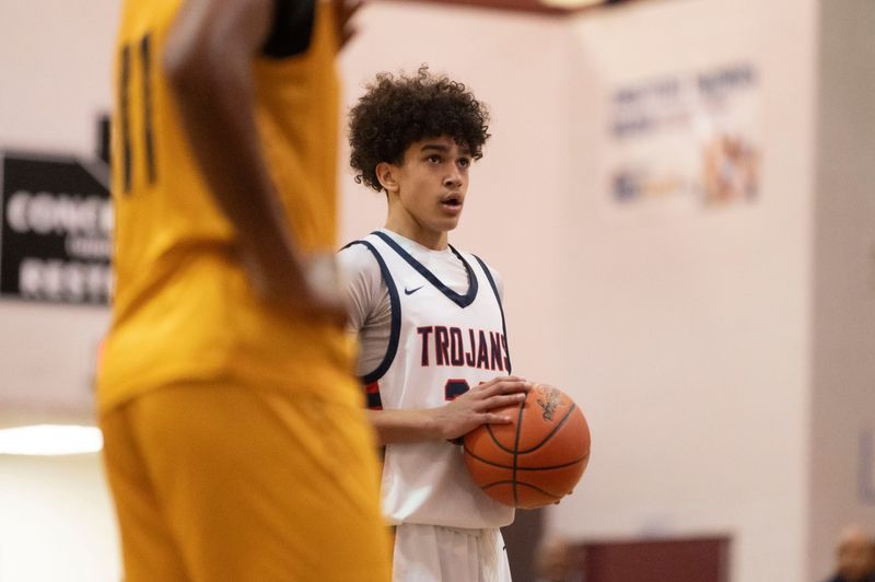 East Lansing freshman Kingston Thomas sets up for a free throw during a regional semifinal game against Waverly at Kalamazoo Central High School on Tuesday, March 5, 2024.