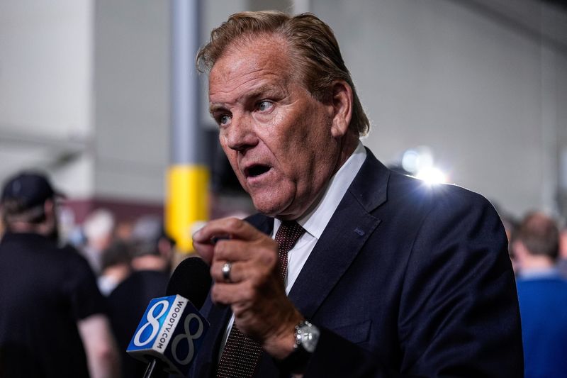 U.S. Senate candidate Mike Rogers speaks to reporters in Howell, Michigan, on Sept. 17, 2025.