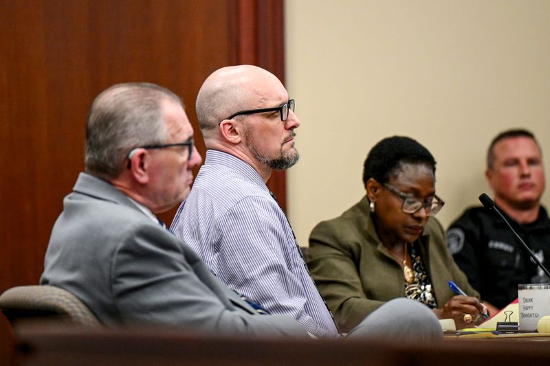 Flanked by attorneys Steven Freeman and Melanie Wandji, Dennis Whaley (center) looks on during his trial in Ingham County Circuit Court Judge Wanda Stokes' courtroom on Thursday, Sept. 18, 2025, at the Veterans Memorial Courthouse in Lansing. Whaley is being tried on murder charges in connection with the April 18, 2024 killings of Christine Cambric and Jason McKenzie.
