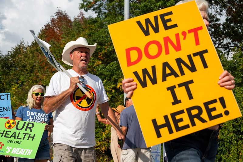 Tim Craiger of Van Buren Township, left, protests with others against the prospective expansion of the Wayne Disposal Inc. landfill in Van Buren Township before a public hearing on the issue hosted by EGLE and the EPA on Thursday, Sept. 18, 2025 at Wayne County Community College in Belleville.
