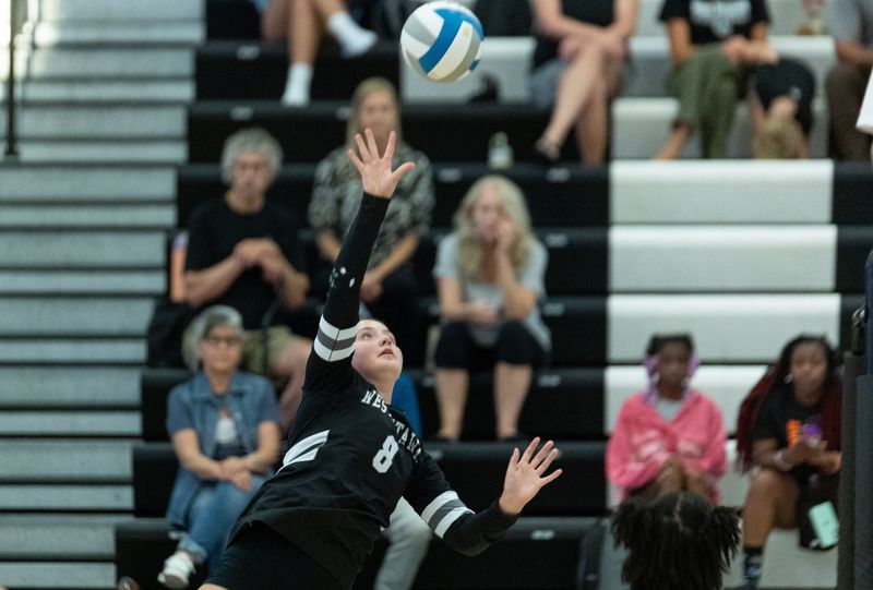 West Ottawa's Akiah Garvelink prepares to spike the ball over the net on Sept. 18.