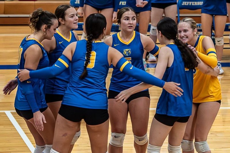 Jefferson's volleyball team celebrates after winning a point.