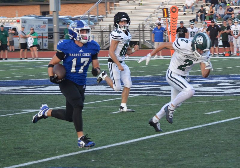 Harper Creek's Gavin Chapman breaks free for a touchdown during the Pennfield at Harper Creek high school football game on Friday, Sept. 19.