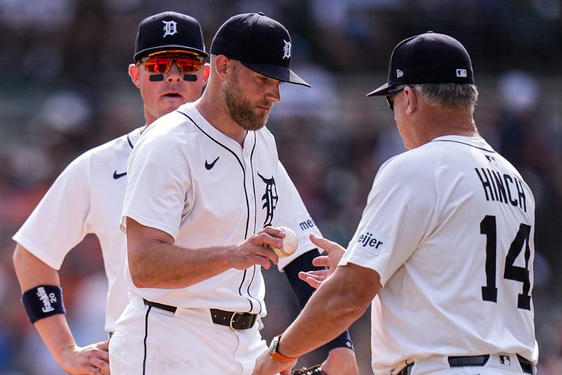 Detroit Tigers pitcher Will Vest (19) hands the ball to manager A.J. Hinch (14) for a pitching change against Atlanta Braves during the ninth inning at Comerica Park in Detroit on Saturday, Sept. 20, 2025.