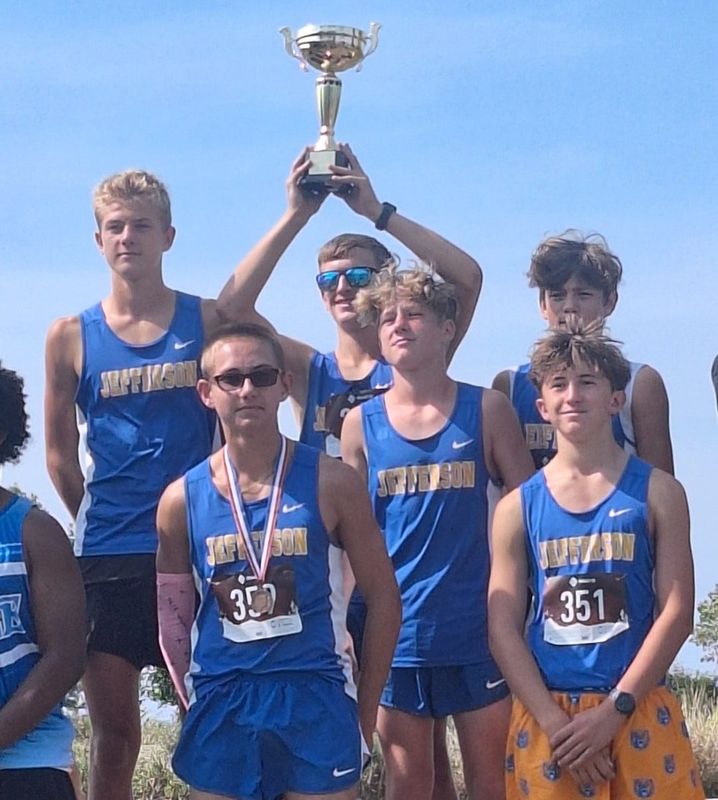 Jefferson's boys cross country team celebrates after winning its own invitational on Saturday, Sept. 20, 2025.