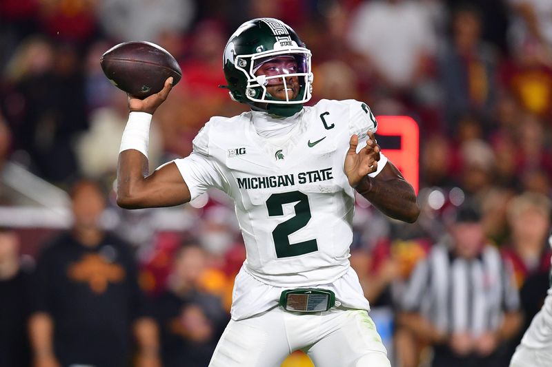 Sep 20, 2025; Los Angeles, California, USA; Michigan State Spartans quarterback Aidan Chiles (2) throws against the Southern California Trojans during the second half at the Los Angeles Memorial Coliseum. Mandatory Credit: Gary A. Vasquez-Imagn Images