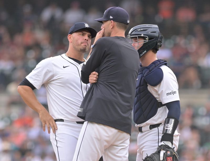From left, Tigers pitcher Tanner Rainey listens to pitching coach Chris Fetter with catcher Dillon Dingler in the ninth inning. Detroit Tigers take on the Atlanta Braves at Comerica Park in Detroit on Sunday, September 21, 2025. Tigers lose, 6-2.