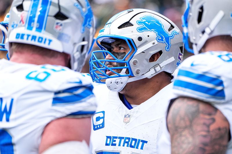 Detroit Lions offensive tackle Penei Sewell looks on during warmups ahead of the season opener at the Green Bay Packers at Lambeau Field in Green Bay, Wis., on Sunday, September 7, 2025.