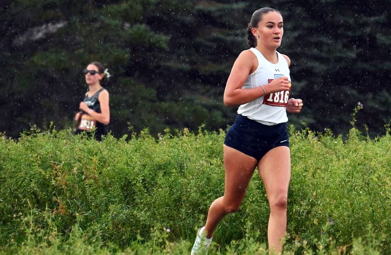 Petoskey senior Ava Pawlick makes a turn and shows off her commanding lead early in the Petoskey Kiwanis Cross Country Invite on Saturday, Sept. 20.